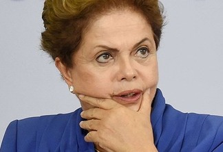 Brazilian President Dilma Rousseff attends a ceremony to sanction a new zero-tolerance femicide law, at Planalto Palace in Brasilia, on March 9, 2015. AFP PHOTO / EVARISTO SA