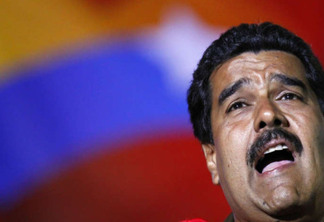 Venezuela's acting President and presidential candidate Nicolas Maduro sings during a campaign rally in Caracas April 5, 2013. Maduro said on Friday that Venezuelan authorities have arrested several people suspected of plotting to sabotage one of his campaign rallies before an April 14 election by cutting the power. REUTERS/Carlos Garcia Rawlins (VENEZUELA - Tags: POLITICS ELECTIONS)