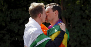 A couple embraces outside the count centre in Dublin as Ireland holds a referendum on gay marriage May 23, 2015. Ireland appears to have voted heavily in favour of allowing same-sex marriage in a historic referendum that marks a dramatic social shift in the traditionally Catholic country, government ministers and opponents of the bill said on Saturday. REUTERS/Cathal McNaughton