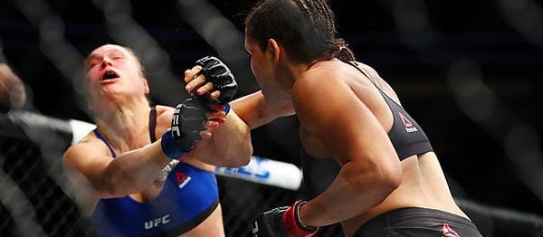 December 30, 2016; Las Vegas, NV, USA; Amanda Nunes lands a hit against Ronda Rousey  during UFC 207 at T-Mobile Arena. Mandatory Credit: Mark J. Rebilas-USA TODAY Sports