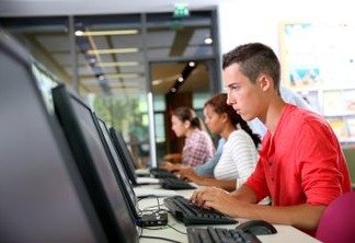 College student working on desktop computer