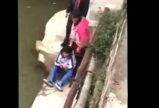 VEJA VÍDEO: Mãe tenta afogar filha em rio por causa de notas baixas na escola