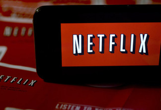 The Netflix Inc. logo is displayed on an Apple Inc. iPhone arranged for a photograph in Washington, D.C., U.S., on Tuesday, Jan. 21, 2014. Netflix Inc., the largest subscription streaming service, is expected to release earnings data on Jan. 22. Photographer: Andrew Harrer/Bloomberg via Getty Images