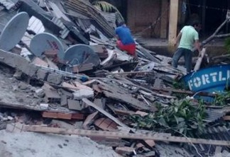 Desabamento de prédio residencial deixa moradores soterrados