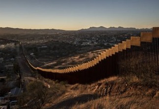 FILE-- The border wall, here made of tall steel beams in rows, in Nogales. Mexico, Jan. 30, 2017.  Trump at a campaign-style rally in Phoenix on Aug. 22 promised he would shut down the government if Congress does not fund a wall on the southern border. Tuesdays admonition sharpened a suggestion that Trump made early this year, in the wake of a budget agreement he grudgingly accepted even though it omitted money for the wall, that the U.S. needed a good shutdown this fall to force a partisan confrontation over federal spending. (Bryan Denton/The New York Times)