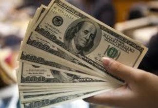 Dólar oscila em patamar de R$ 4,16 por cautela com emergentes e eleição