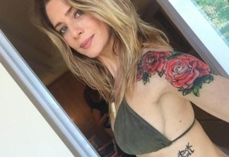 Letícia Spiller posta nude e exibe linda tatuagem nas costas