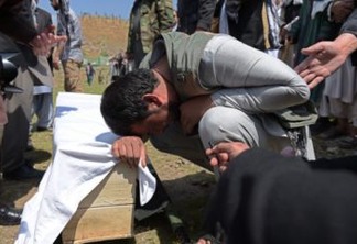 A relative weeps over the coffin of a victim killed in the April 19 Taliban truck bomb attack, at a funeral in Kabul on April 20, 2016.

Thirty people were killed and hundreds wounded when a Taliban truck bomb tore through central Kabul and a fierce firefight broke out on April 19, one week after the insurgents launched their annual spring offensive. The brazen assault near the defence ministry marks the first major Taliban attack in the Afghan capital since the insurgents announced the start of this year's fighting season. / AFP PHOTO / SHAH MARAI