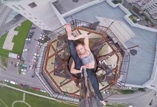 PERFORMANCE: Mulher se arrisca e faz pole dance em topo de prédio de 16 andares; VEJA VÍDEO