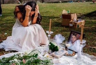 'Noiva viúva' põe vestido branco para 'cerimônia' em cemitério