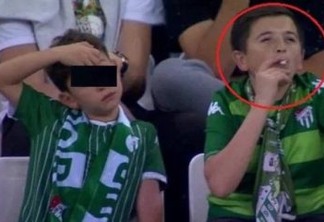 'Menino' fumante visto em estádio estava com o próprio filho - VEJA VÍDEO