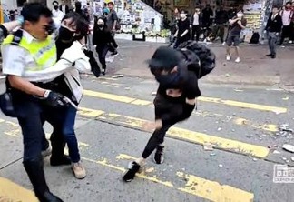 IMAGENS FORTES: Policial de Hong Kong atira em manifestante encapuzado - VEJA VÍDEO