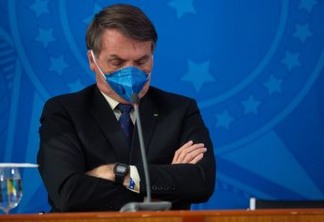 BRASILIA, BRAZIL - MARCH 20: Jair Bolsonaro President of Brazil reacts with wear protective mask during a press conference about outbreak of the coronavirus (COVID - 19) at the Planalto Palace on March 20, 2020 in Brasilia, Brazil. (Photo by Andressa Anholete/Getty Images)