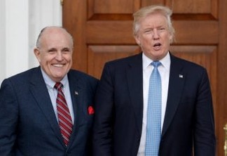 FILE - In this Nov. 20, 2016, file photo, then-President-elect Donald Trump, right, and former New York Mayor Rudy Giuliani pose for photographs as Giuliani arrives at the Trump National Golf Club Bedminster clubhouse in Bedminster, N.J. Giuliani is joining the legal team defending President Donald Trump in the special counsel’s Russia investigation. That’s according to a statement from Trump personal attorney Jay Sekulow. (AP Photo/Carolyn Kaster, File)