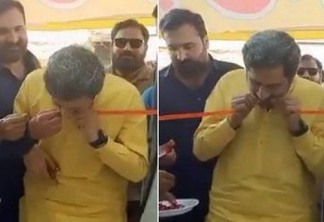 Com tesoura cega, ministro apela aos dentes para cortar faixa em inauguração de loja