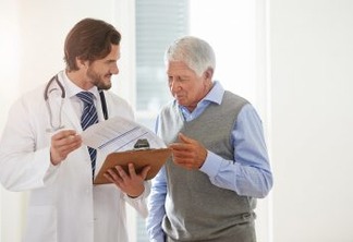 Cropped shot of a doctor talking to a senior patient in a clinic