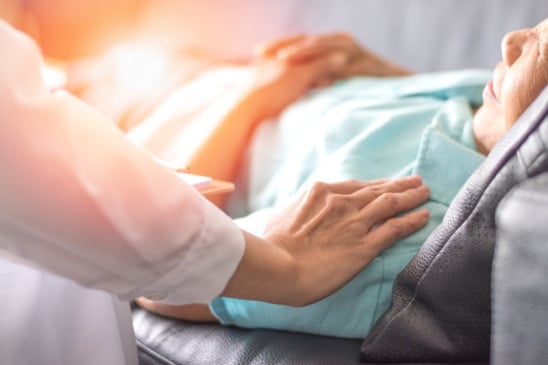 Caregiver, carer hand holding elder hand woman in hospice care. Philanthropy kindness to disabled concept.Public Service Recognition Week (Caregiver, carer hand holding elder hand woman in hospice care. Philanthropy kindness to disabled concept.Public